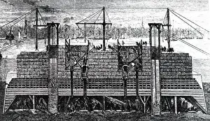 Suspension: Men working in a caisson used to build one of