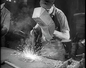 Two Men Working in a Factory