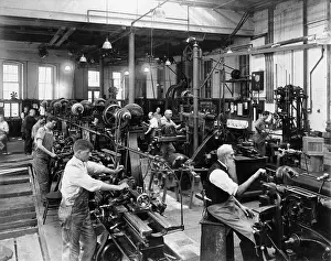 Alienation: Men working at machines in the Government ?