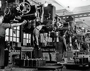 Lathes: Men working on milling machines indoor
