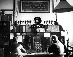 Switchboards: Men working at watchroom telephone switchboard