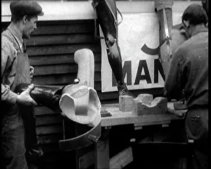 Prosthetic: Men at a Workshop Crafting and Carving Prosthetic Legs