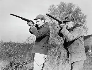 Gunning: Men Young Senior with Shot Guns Aiming Towards Camera