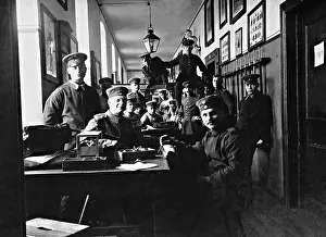 Mending: Mending hour in a German barracks, 1908