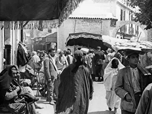 Balancing: Merchants in the streets of Tunis, 1936