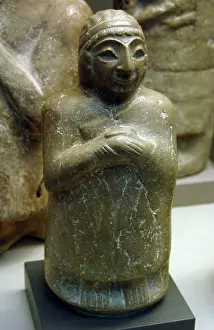 Votive: Mesopotamia. Limestone statue of a woman. Kingdom of Lagash