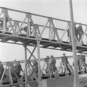 Inclined: Metal Bridge With Cyclists