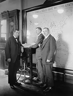 Middle Aged: Meteorologists at the U.S. Weather Bureau stand