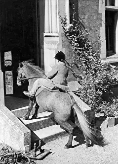 Micheal: Michael Carleton Smith on a Pony on the way in a house