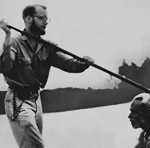 Poling: Michael Rockefeller, in a canoe with a native during