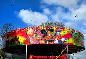 Roundabout: Mickey Mouse characters on a fairground roundabout