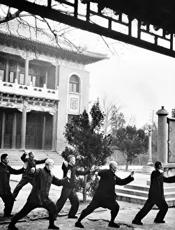 Unison: Middle-aged Chinese men practice T'ai chi ?