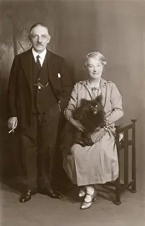 Lapdog: Middle aged couple with dog