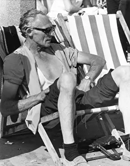 Deckchairs: Middle-aged man in a deckchair at the seaside