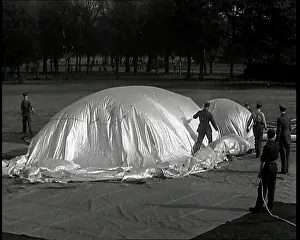 Inflating: Military Men Inflating a Barrage Balloon on