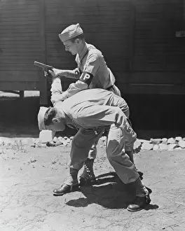 Defending: Military police Privates practice disarming