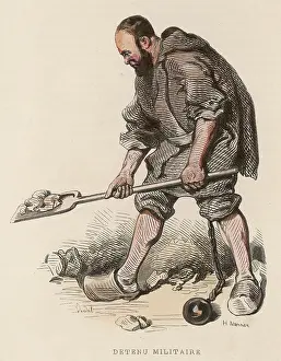 Shackled: Military prisoner doing hard labour with ball and chain