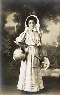 Milkmaid: A milkmaid posing with a milk jug and milking stool