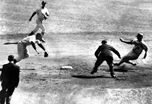Umpires: Milwaukee Brave Joe Adock slides into second ?