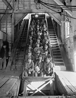 Superintendents: Miners in an open tram at the Calumet and ?