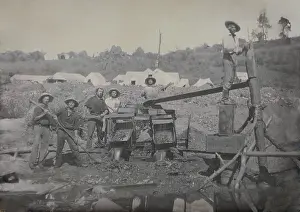 Lcgr2001: Six miners work with a placer mining apparatus