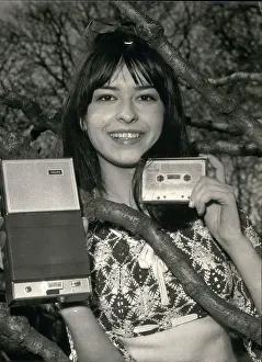 Bigger: Miniature music box compared with transistor radio