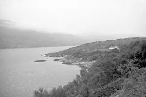 Lochs: Misty hills over a mountain loch