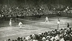 Doubles: Mixed doubles match in progress, Wimbledon, SW London
