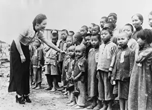 Chongqing: Mme. Chiang Kai Shek with orphans she adopted after