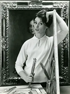 Leans: Modeal as artist in smart collared sweater