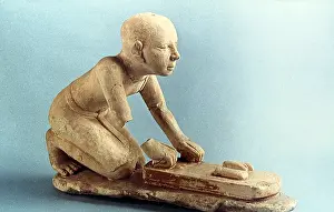 Loaves: Model of a baker kneading dough and forming loaves
