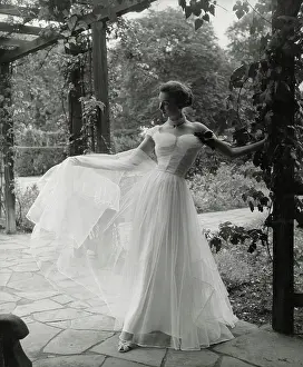 Bodice: Model Barbara Goalen in sheer net evening gown