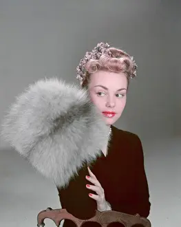 Coiffured: MODEL WITH FUR MUFF