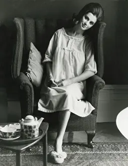 Slippers: Model in an interior setting enjoying her morning cup of tea