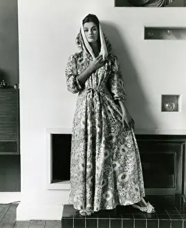 Slippers: Model in interior setting, floral dressing gown and slippers