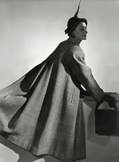 Folds: Model in a long woollen cape coat