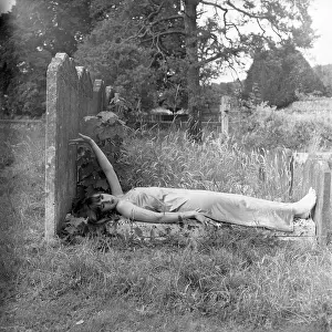 Slim: Model posing in a graveyard