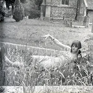 Slim: Model posing in a graveyard