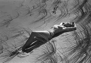 Naturism: Model reclining in the sand dunes