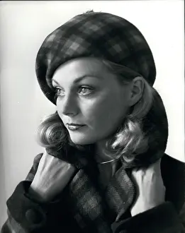 Pompom: Model in Scottish plaid beret designed by Carven