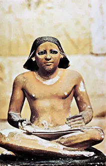 Scribe: Model of seated scribe. 5th Dynasty c2750 BC