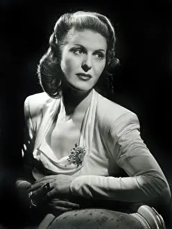 Padded: Model in smart white dress with padded shoulders