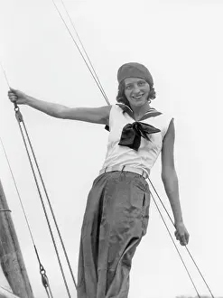 Sportswear: Model with sportswear on a sailing boat