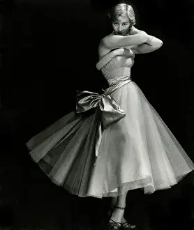 Sandys: Model in strapless full-skirted dress with bow