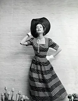 Dots: Model in a summer dress with a stripe and dot pattern
