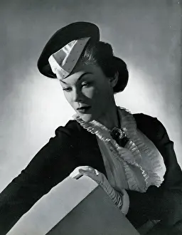 Dots: Model wearing Agnes hat 1937