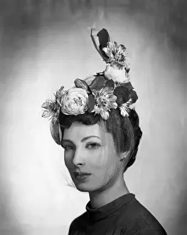 Dache: A model wearing a hat by Lilly Dache made ?