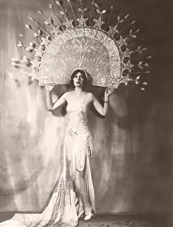 1910s 1940s: Model wearing large headdress