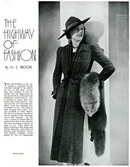 Slanted: Model wearing a full length coat 1937