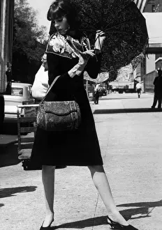 Katz: Model wearing a scarf by Sally Gee, bag ?